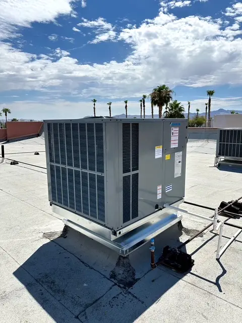 Commercial HVAC unit on Las Vegas rooftop with palm trees