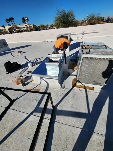 HVAC technician performing rooftop installation in Las Vegas